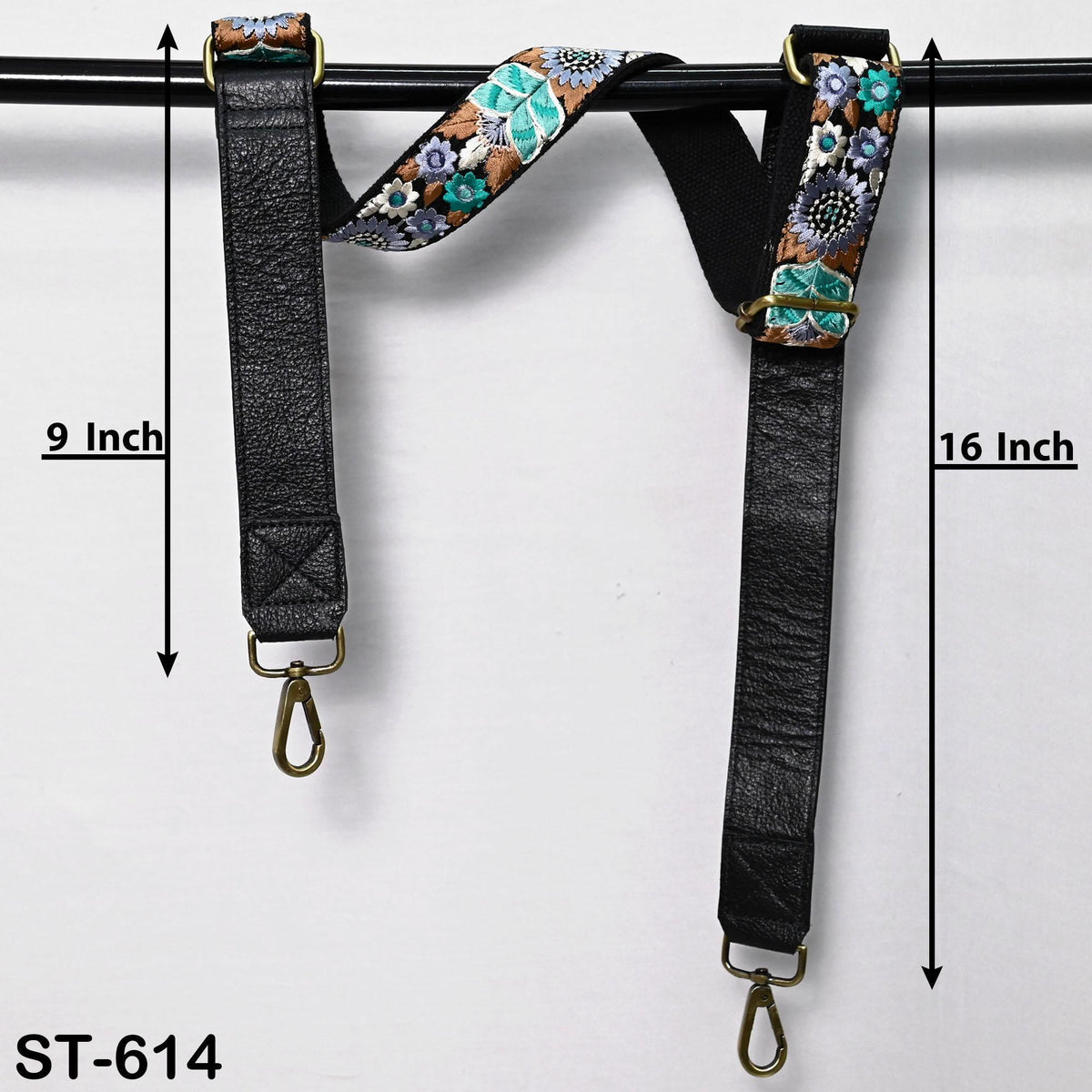 two black leather straps with floral patterns, each measuring 9 inches in length. The straps are hanging on a black rod, and there is text indicating the strap's size.