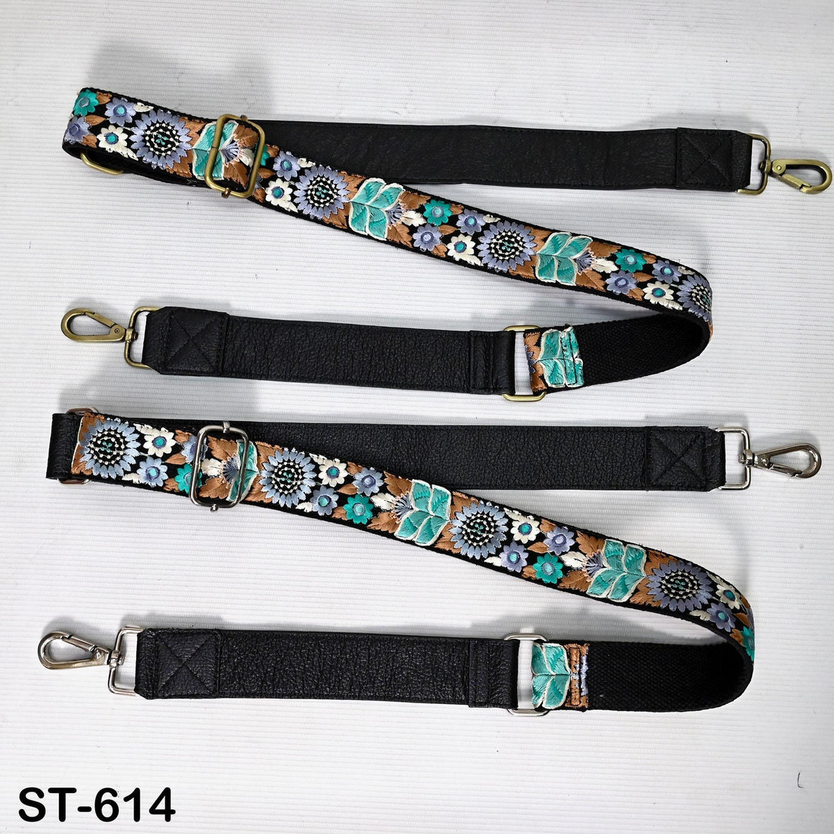 a collection of colorful, patterned straps or straps with floral designs, arranged on a white background.