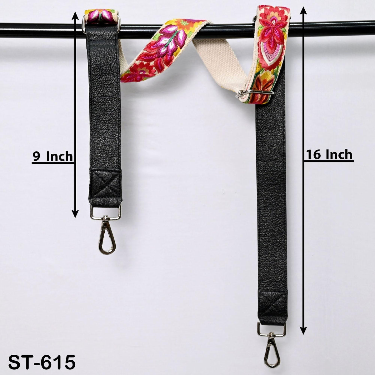 two black straps with floral patterns, hanging from a black bar. The straps are 9 inches long and 16 inches long.