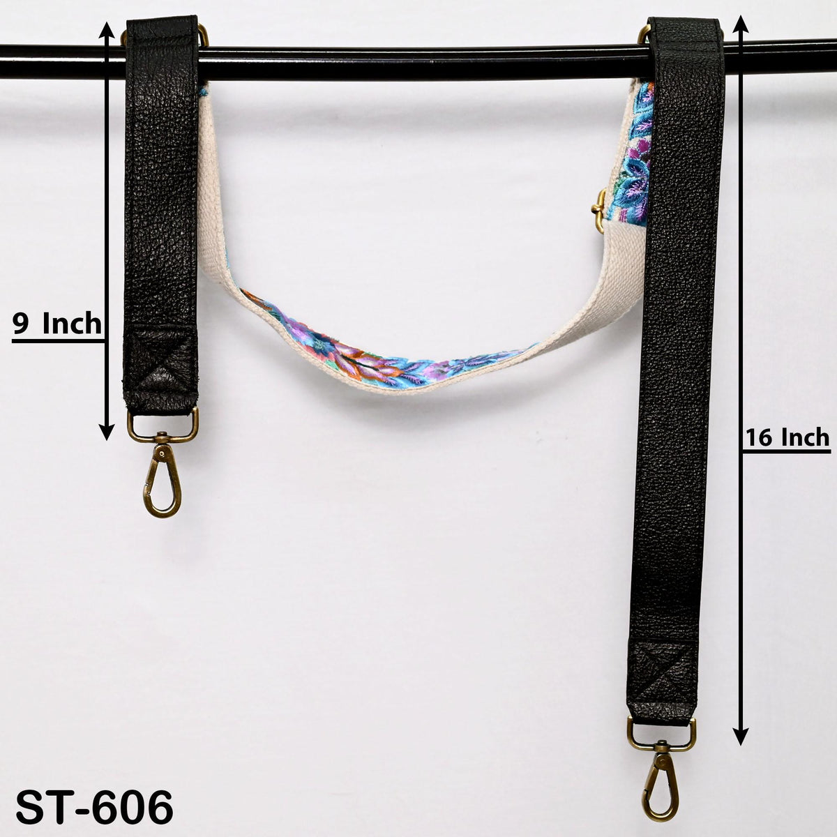a pair of black leather straps with metal hooks, hanging on a black rod. The straps are 9 inches and 16 inches long, respectively. The image also includes a text that reads "ST-606".