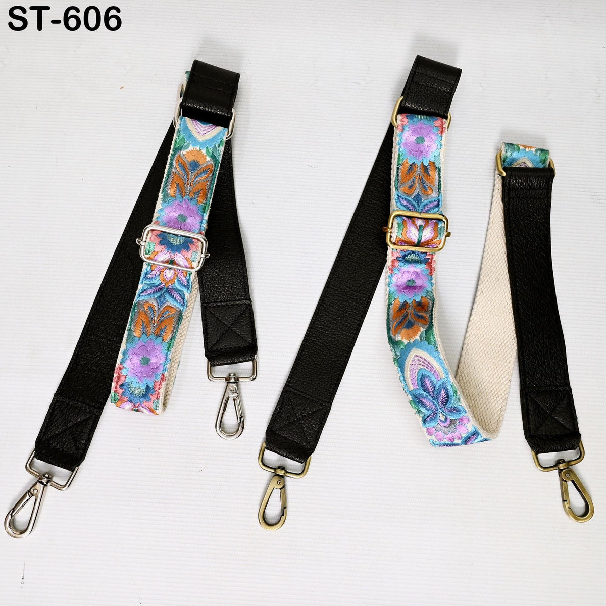 a collection of colorful straps with metal hooks, arranged on a white background.