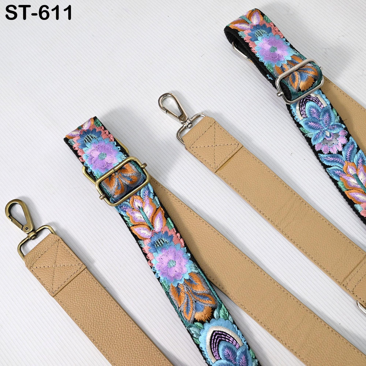 a collection of colorful, patterned straps or straps with floral designs, arranged on a white background.