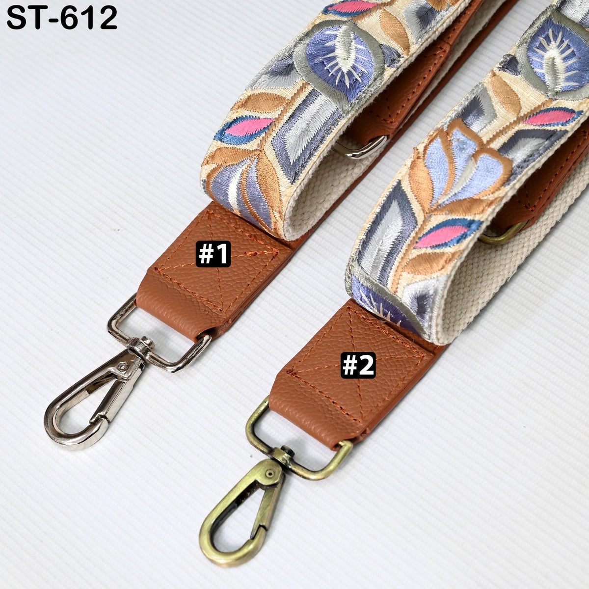 two colorful straps with metal hooks, one with a metal hook and the other with a metal loop, both of which are attached to a strap.