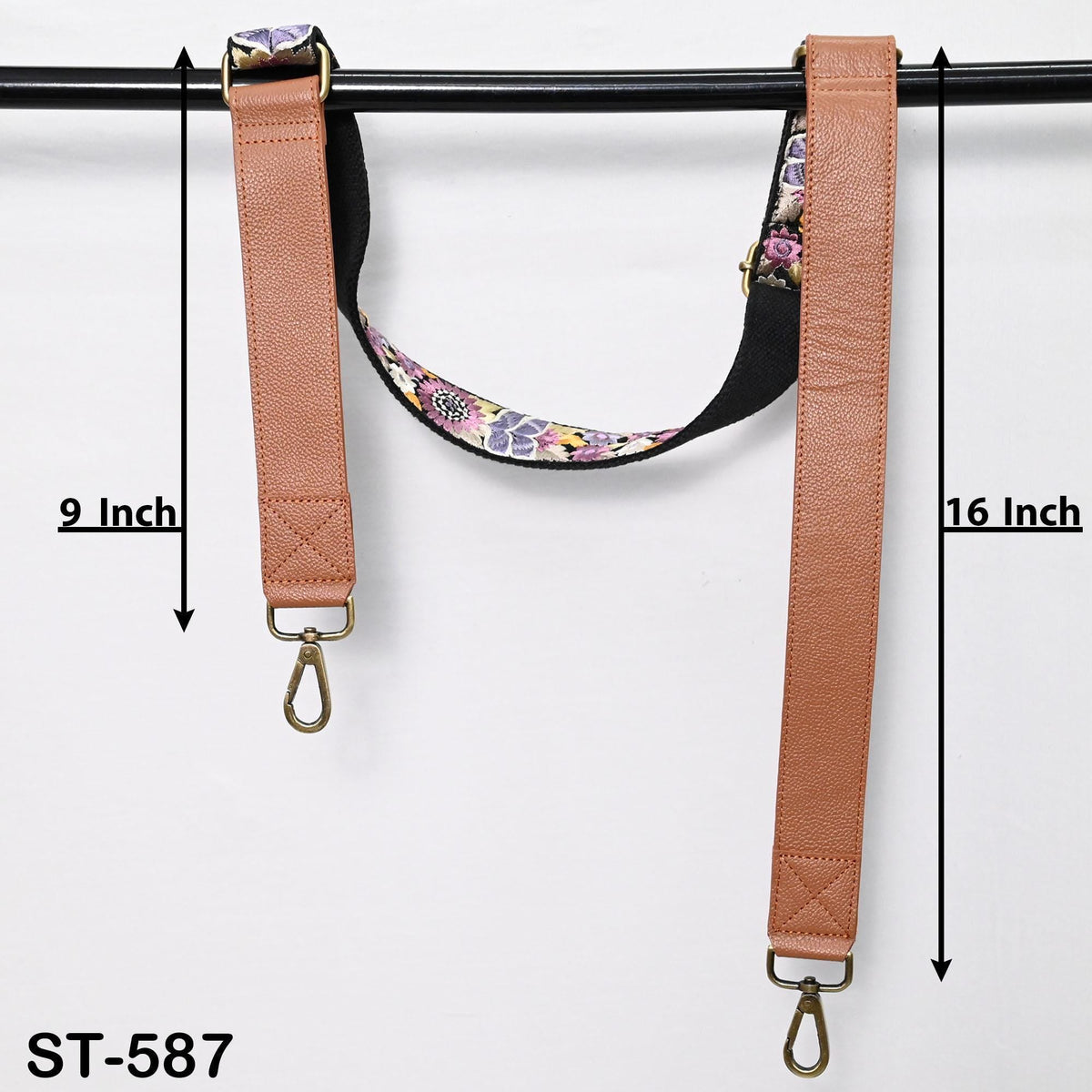 two straps, one with a floral pattern and the other with a plain strap, hanging on a black bar. The strap on the left is 9 inches long, and the strap on the right is 16 inches long.