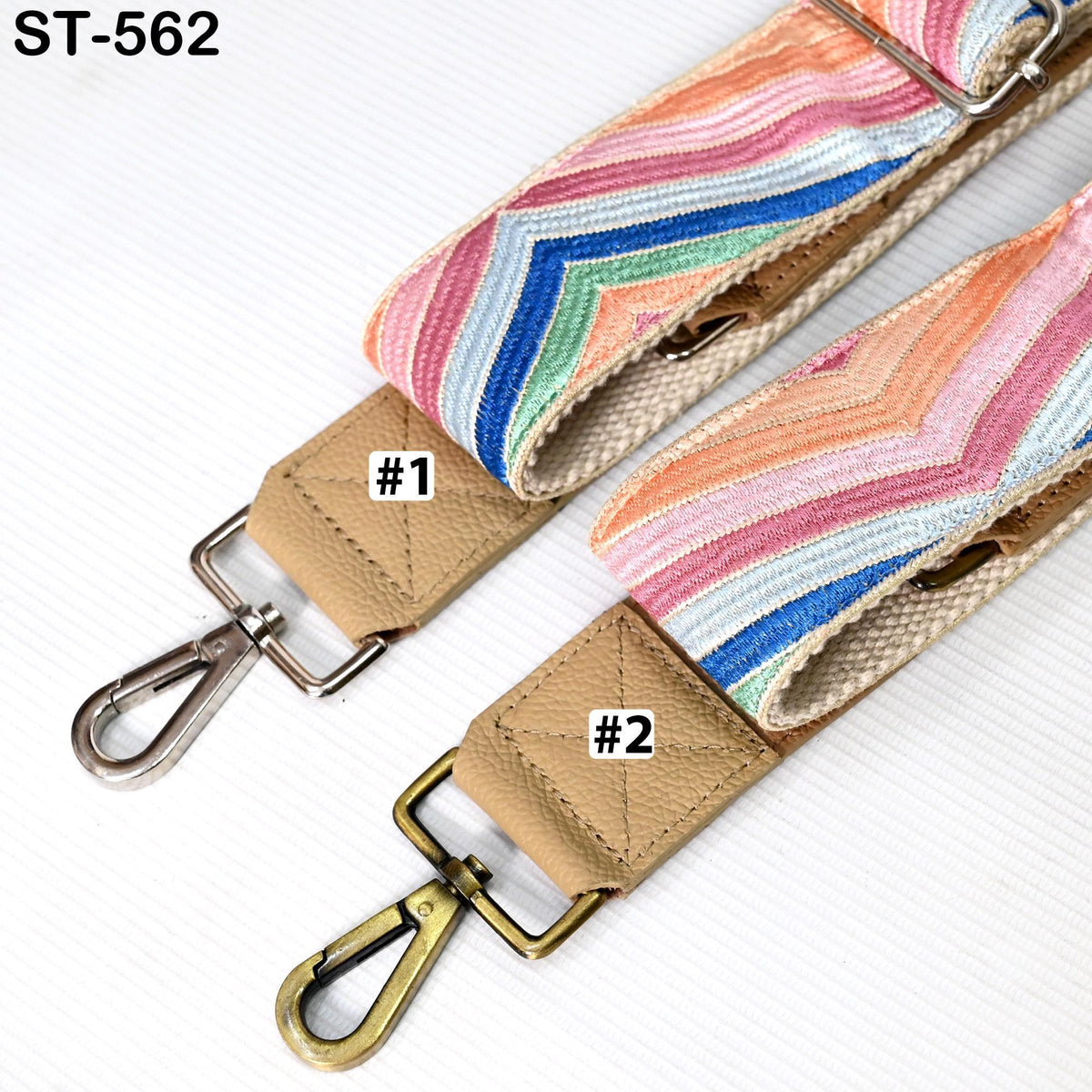 two colorful straps with metal hooks, one with a metal hook and the other with a metal loop, both attached to a strap.
