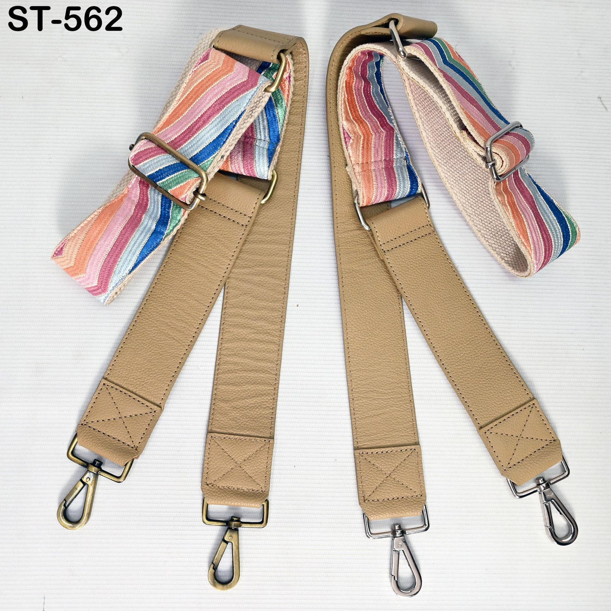two beige leather straps with metal hooks attached, placed side by side on a white background.
