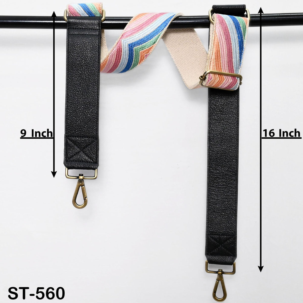 a pair of black leather straps with colorful stripes hanging from a black metal bar. The straps are labeled with measurements, indicating they are 9 inches and 16 inches long.
