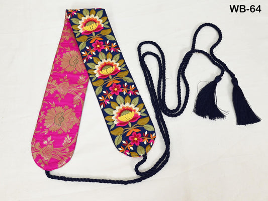 a colorful scarf with a floral pattern, including pink and blue colors, and a black tassel.