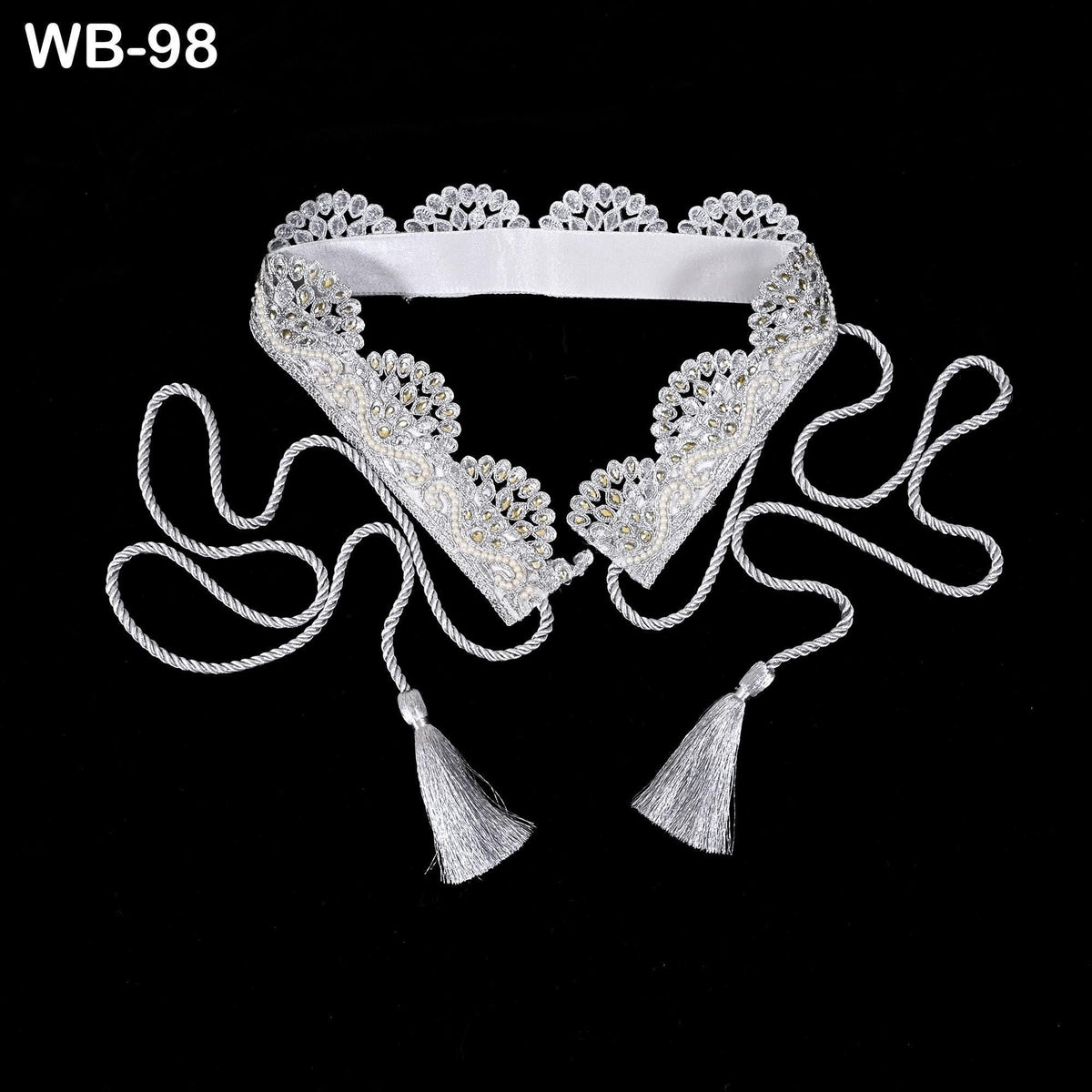 A white, ornate collar with tassels and a lace-like design, displayed against a black background.