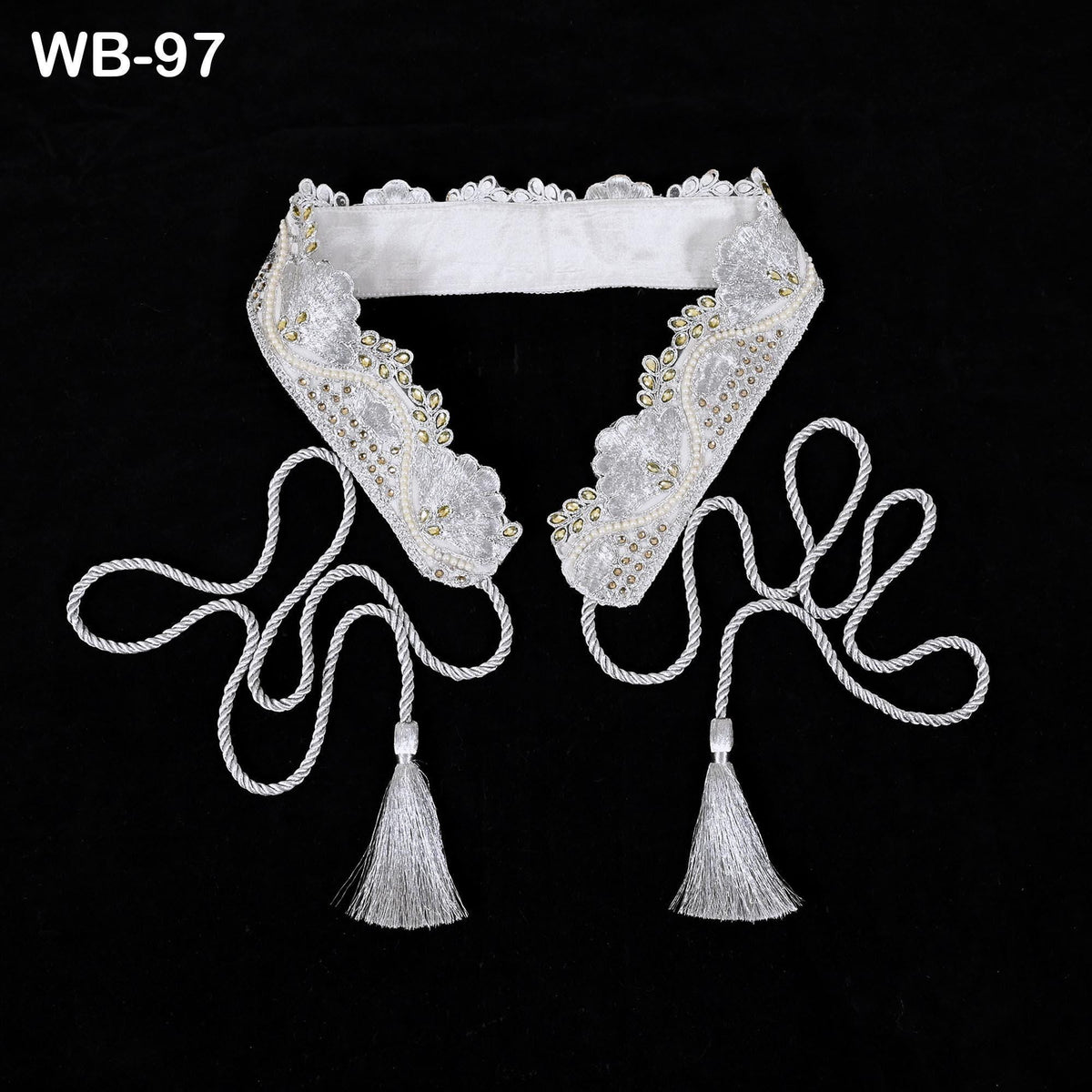 A white lace collar with tassels and a white ribbon, displayed against a black background.