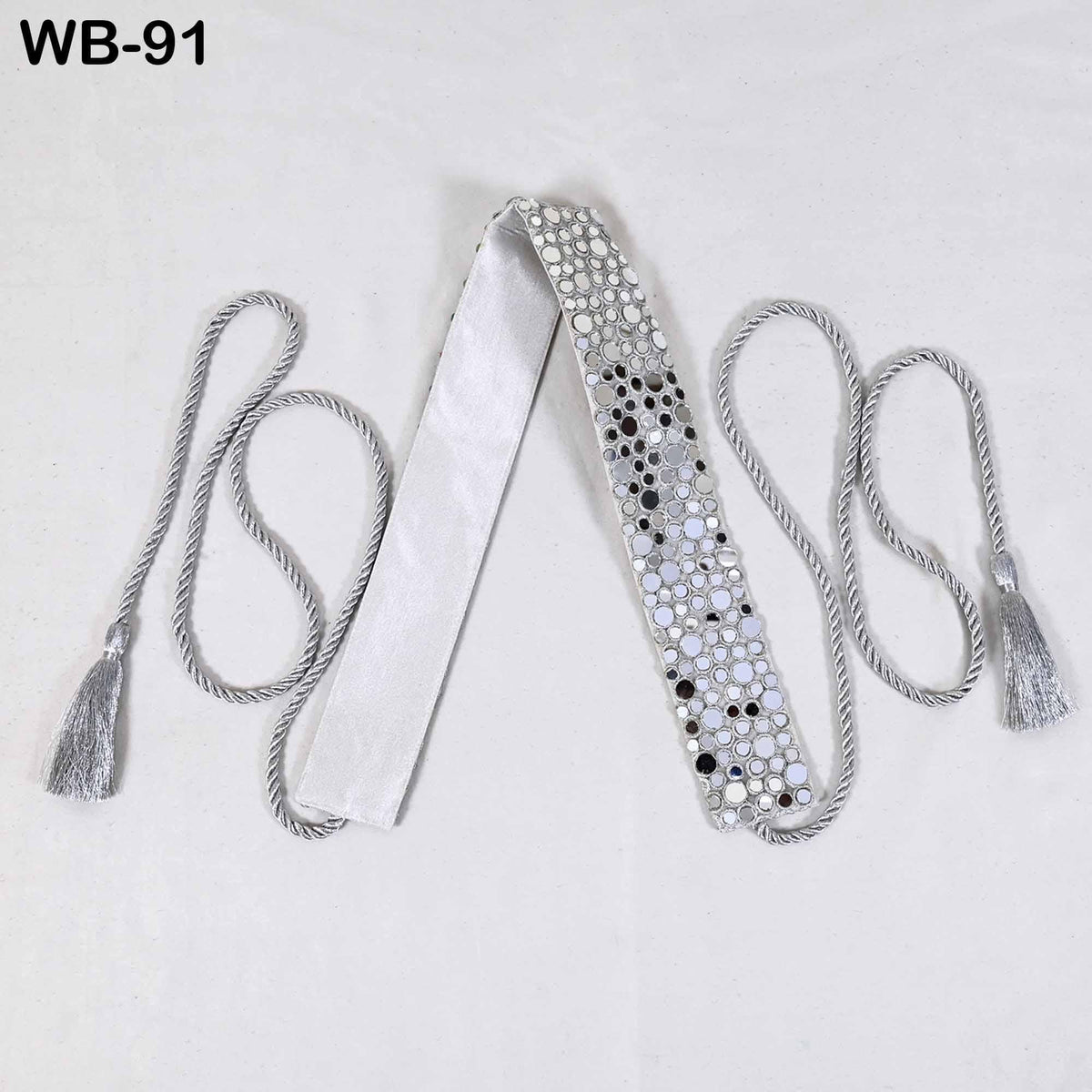 a white tie with silver rhinestones or crystals on it, along with two gray tassels or strings attached to it.
