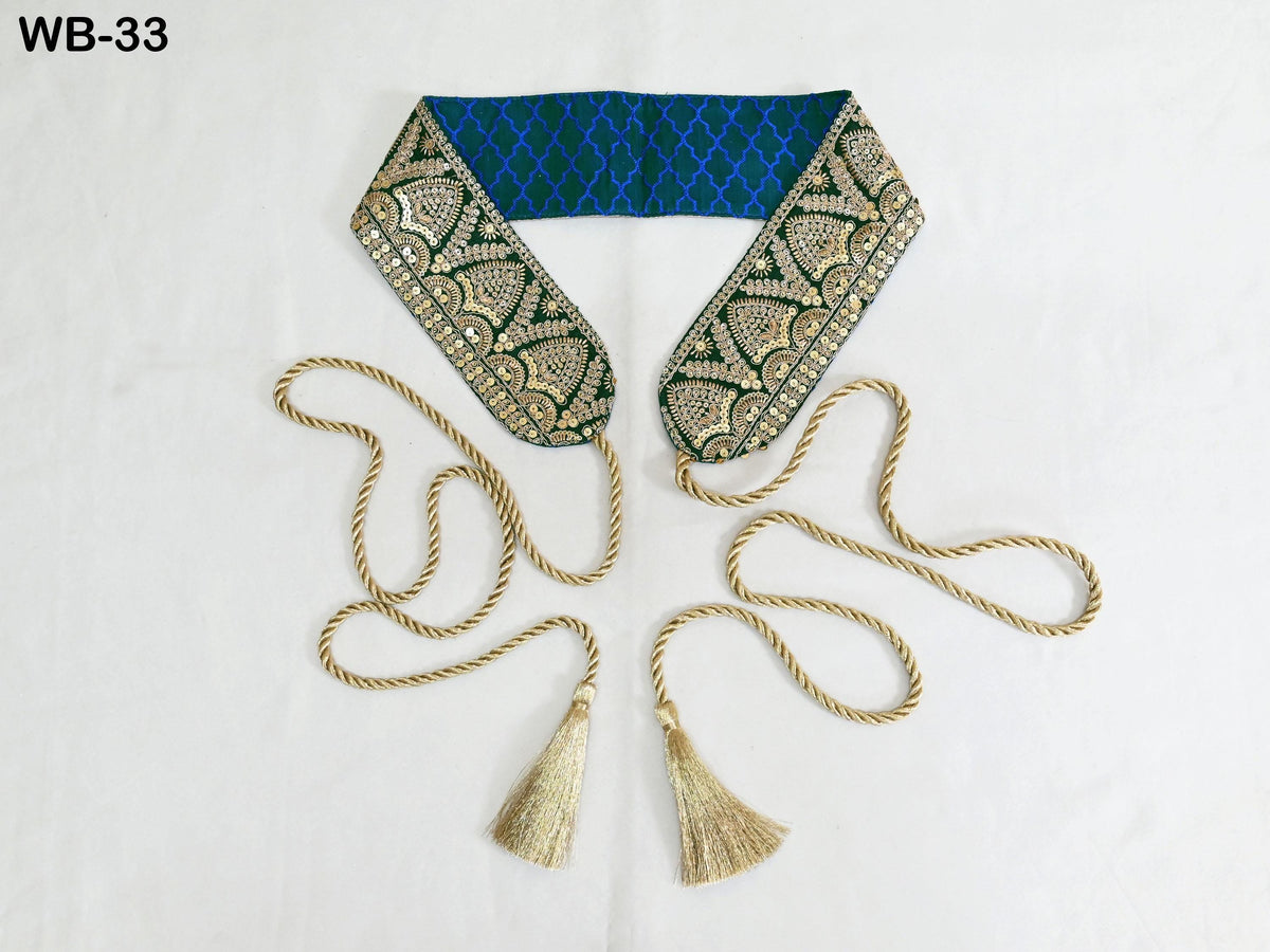 a decorative scarf with a blue and gold patterned fabric and gold tassels.