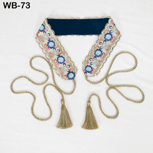 A decorative collar with a floral pattern and tassels, along with a rope or cord, is displayed on a white background.