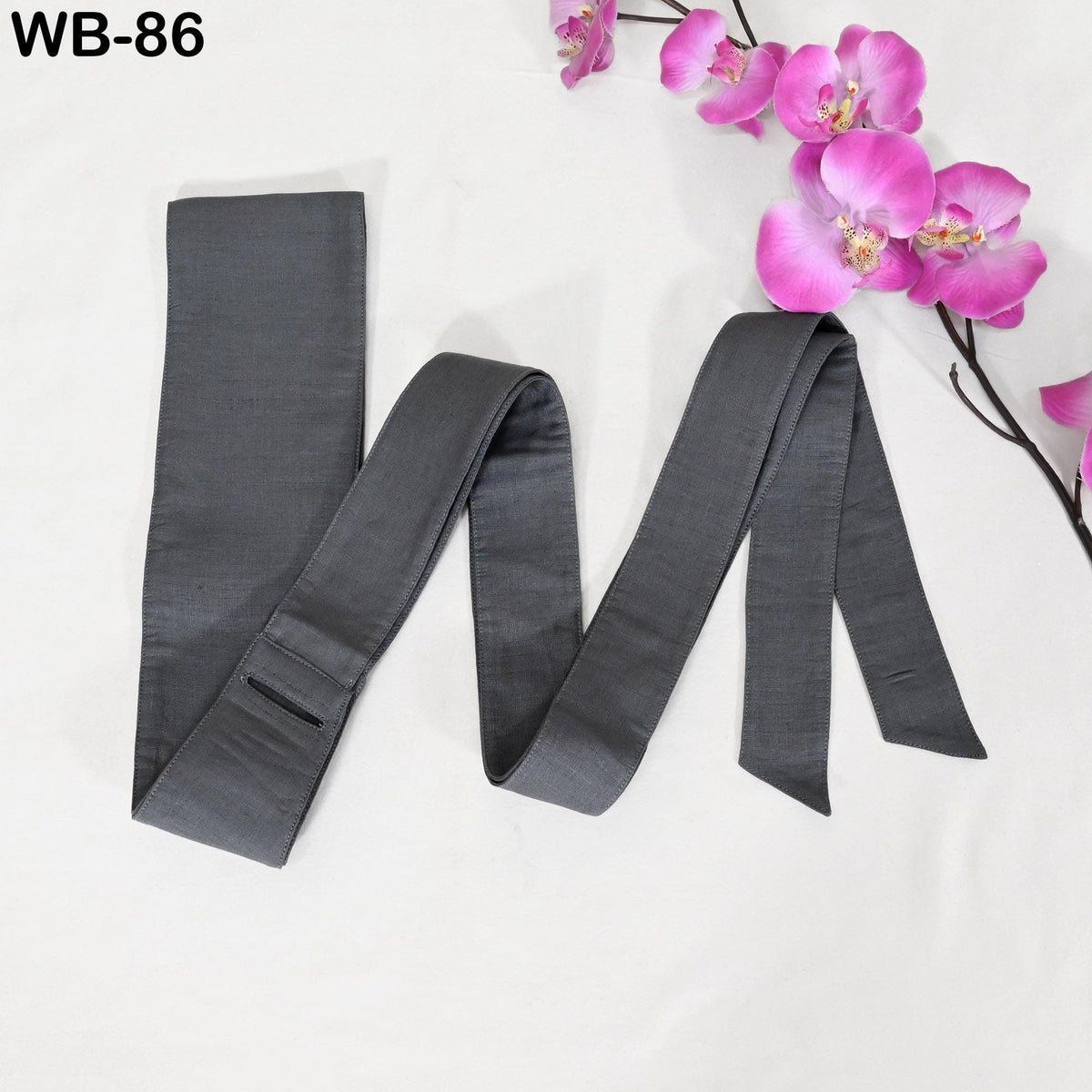a gray tie with a floral arrangement of pink orchids on a white background.