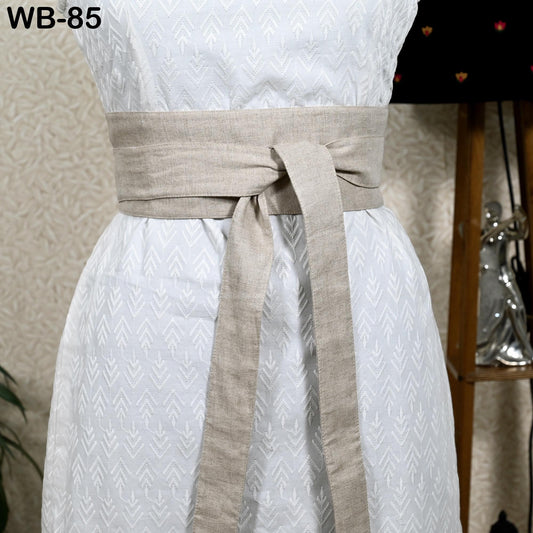 A white dress with a beige belt, displayed on a mannequin.