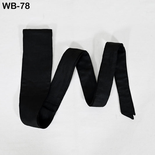 A black tie is shown in the image, lying on a white background.