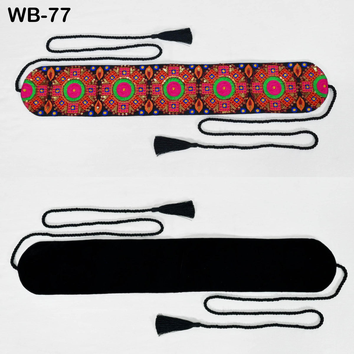 a colorful, patterned fabric with a black tassel attached to it.