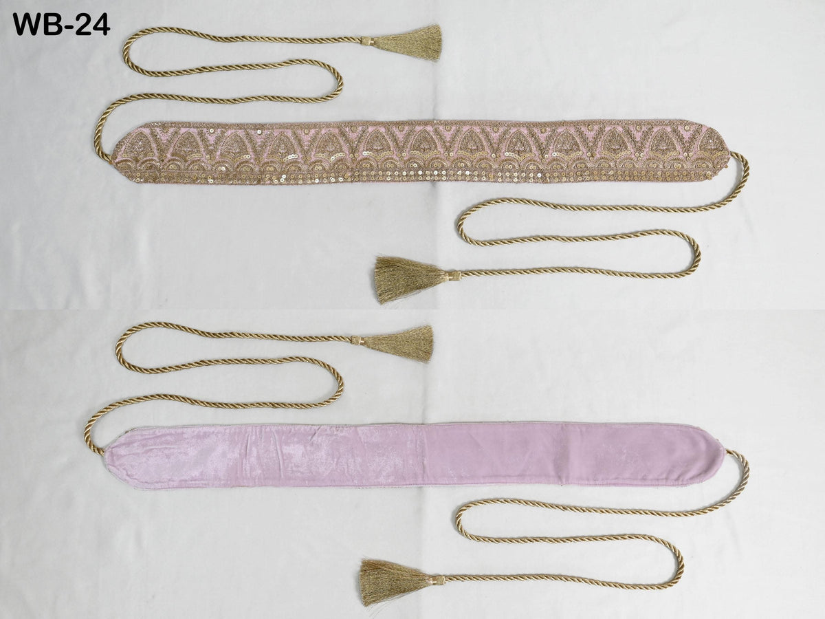 two decorative items with tassels, one in a pink color and the other in a gold color, both with a long, decorative strap.