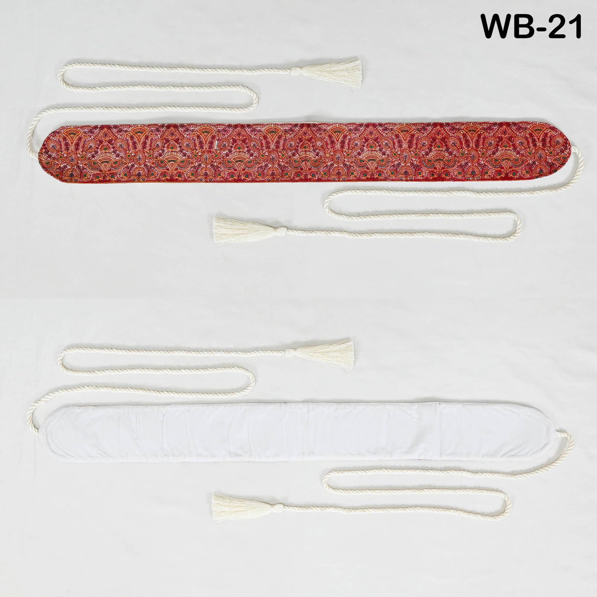 two rectangular fabric items, one with a red and white pattern and the other with a white pattern. The items are connected by white strings, and there are white tassels attached to them.