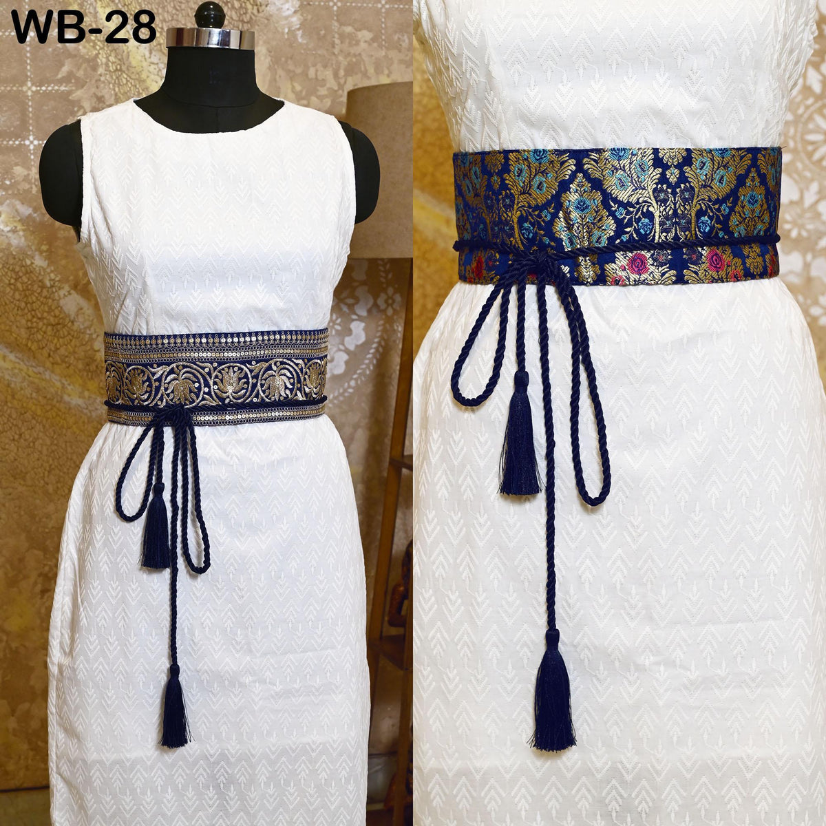 two white dresses with blue and gold decorative belts. The dresses have a simple, elegant design with a white bodice and a white skirt. The belts feature a floral pattern in blue and gold, adding a touch of sophistication to the outfits.