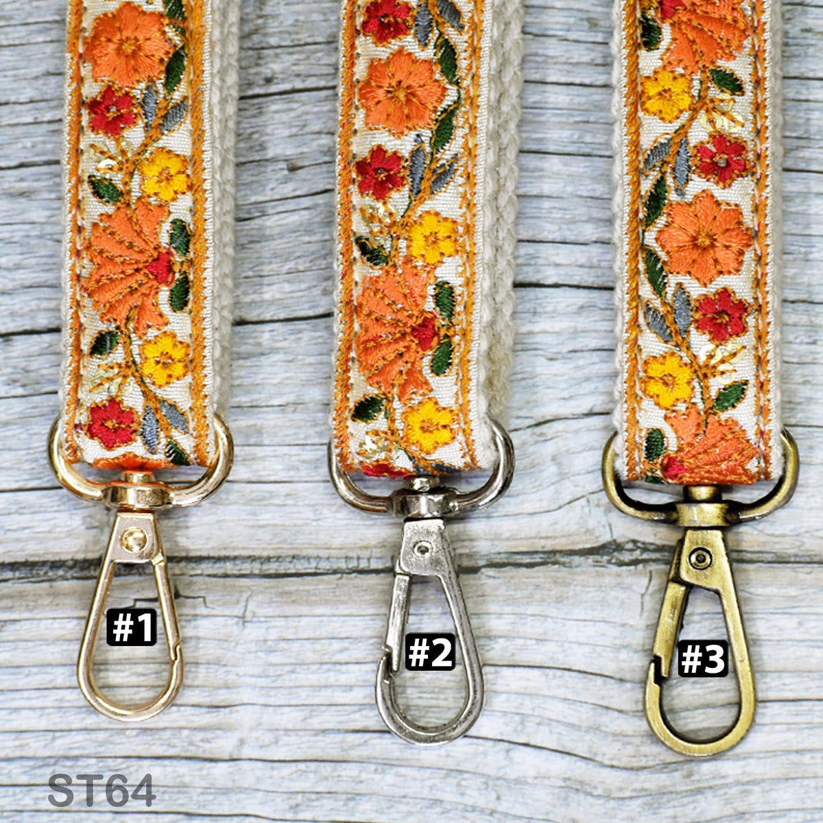 Three colorful floral-patterned straps with metal clasps, each with a different number printed on it.