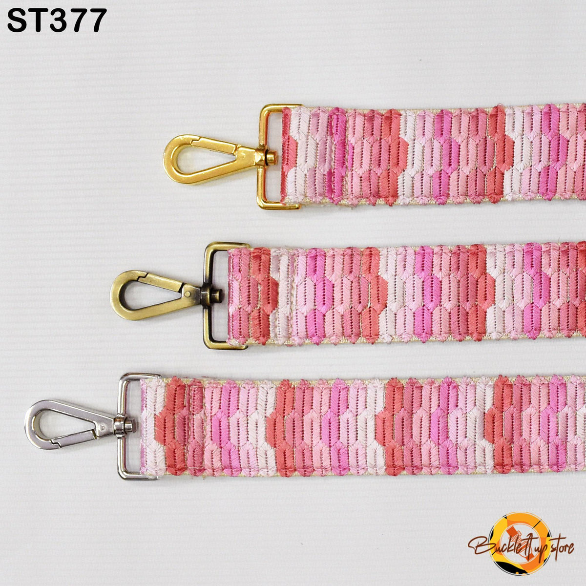three colorful straps with gold and silver metal hooks, arranged in a row on a white background.
