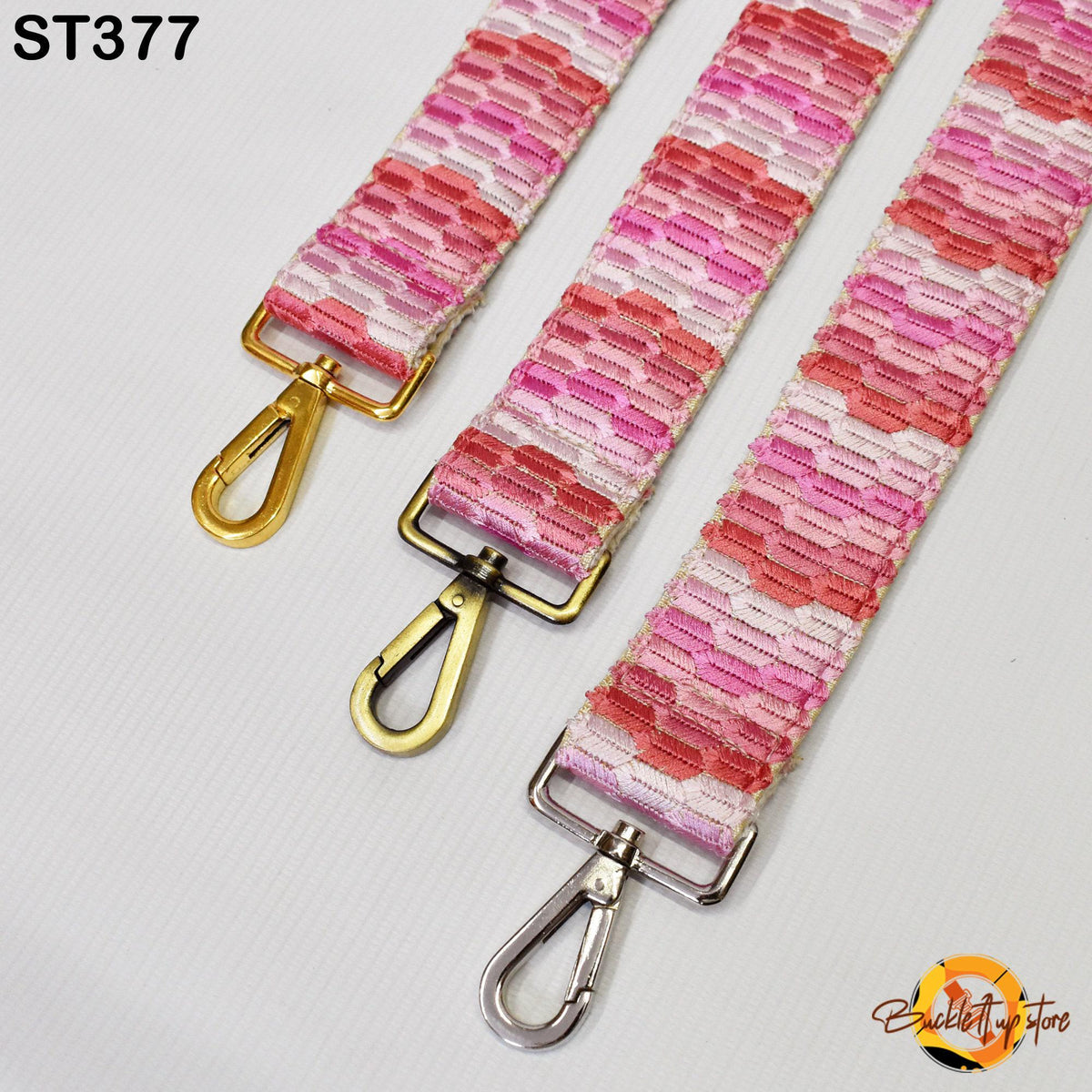 three colorful straps with gold and silver metal hooks, arranged side by side on a white background.
