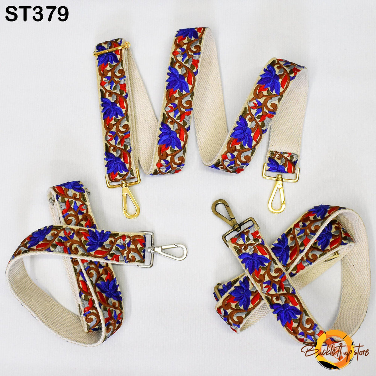 a collection of colorful, patterned straps with gold hardware, including a floral pattern, a floral and red pattern, and a floral and blue pattern.