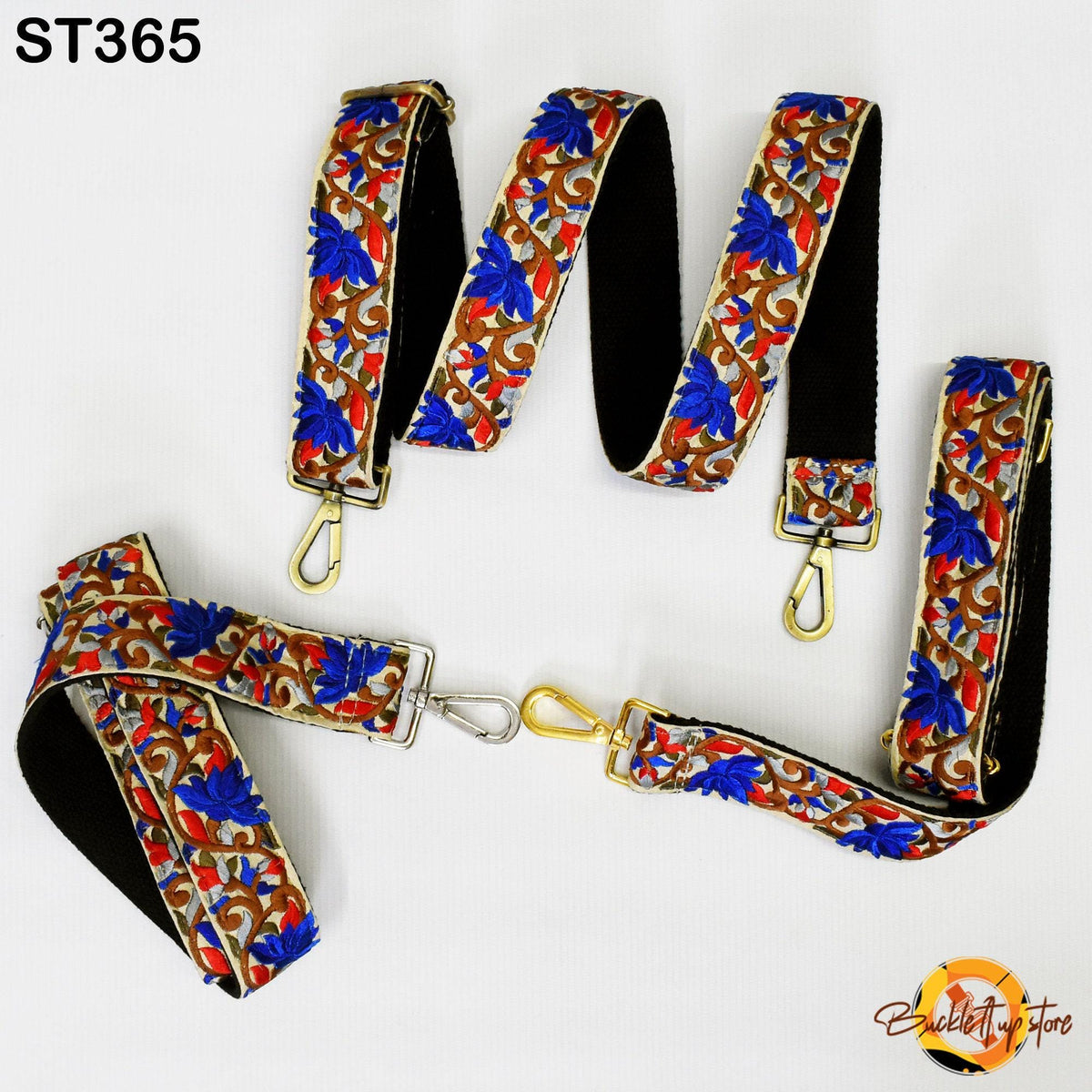 a set of colorful, patterned straps with floral designs in blue, red, and gold. The straps appear to be made of fabric and are arranged in a row, with some of them attached to a black background.