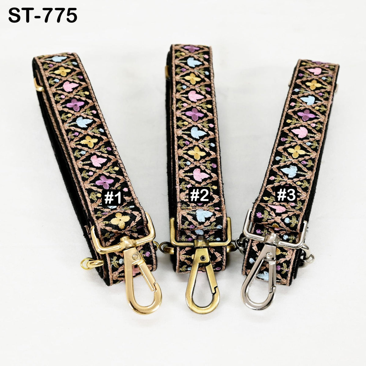 Three colorful straps with floral patterns, each with a gold-colored metal clasp and hook.