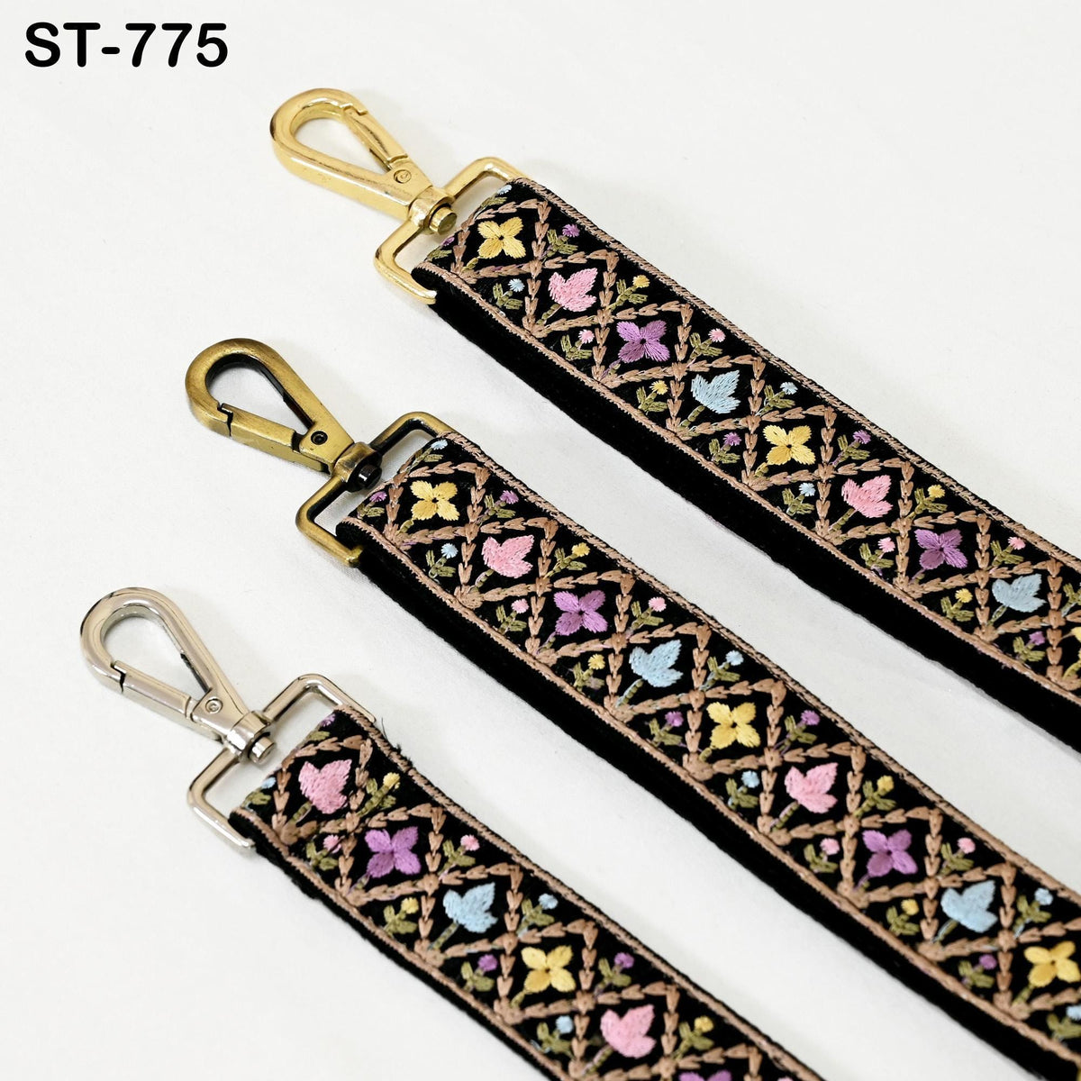 three colorful straps with floral patterns, each featuring a metal clasp and hook.