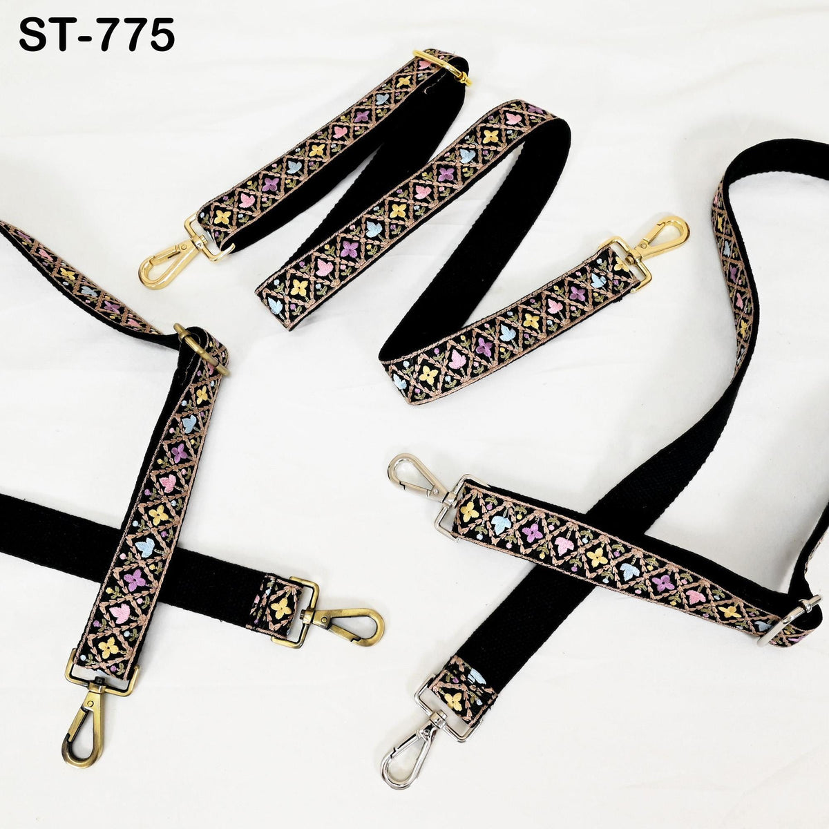 a collection of colorful, patterned straps or straps with metal buckles, arranged on a white background.