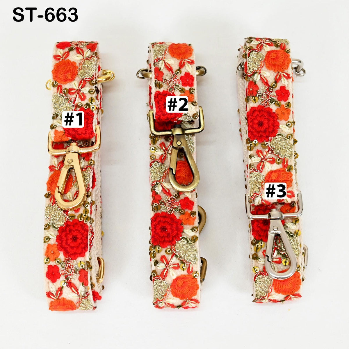 Three colorful straps with floral patterns, each with a different number attached to it.