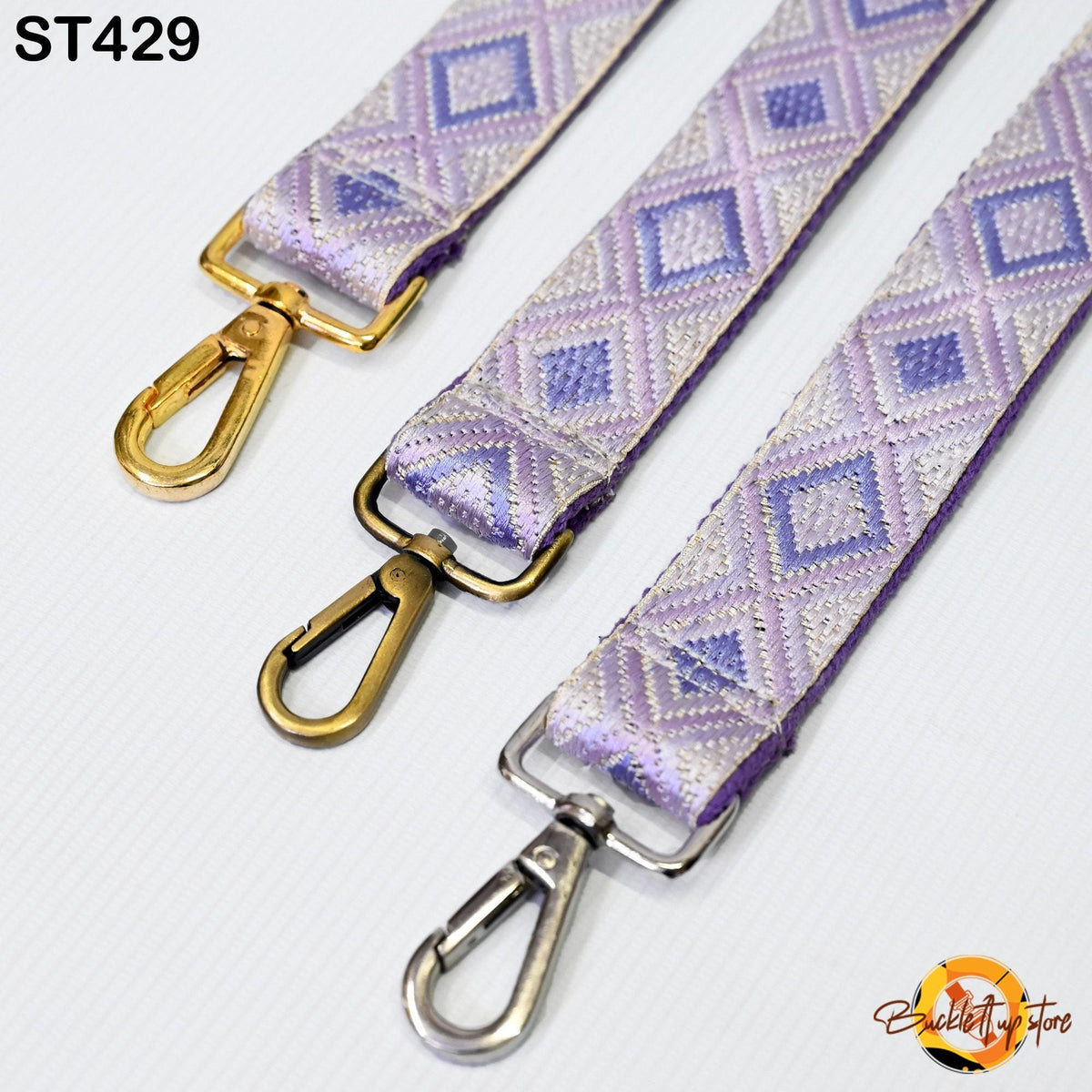 three colorful straps with metal hooks, arranged side by side.
