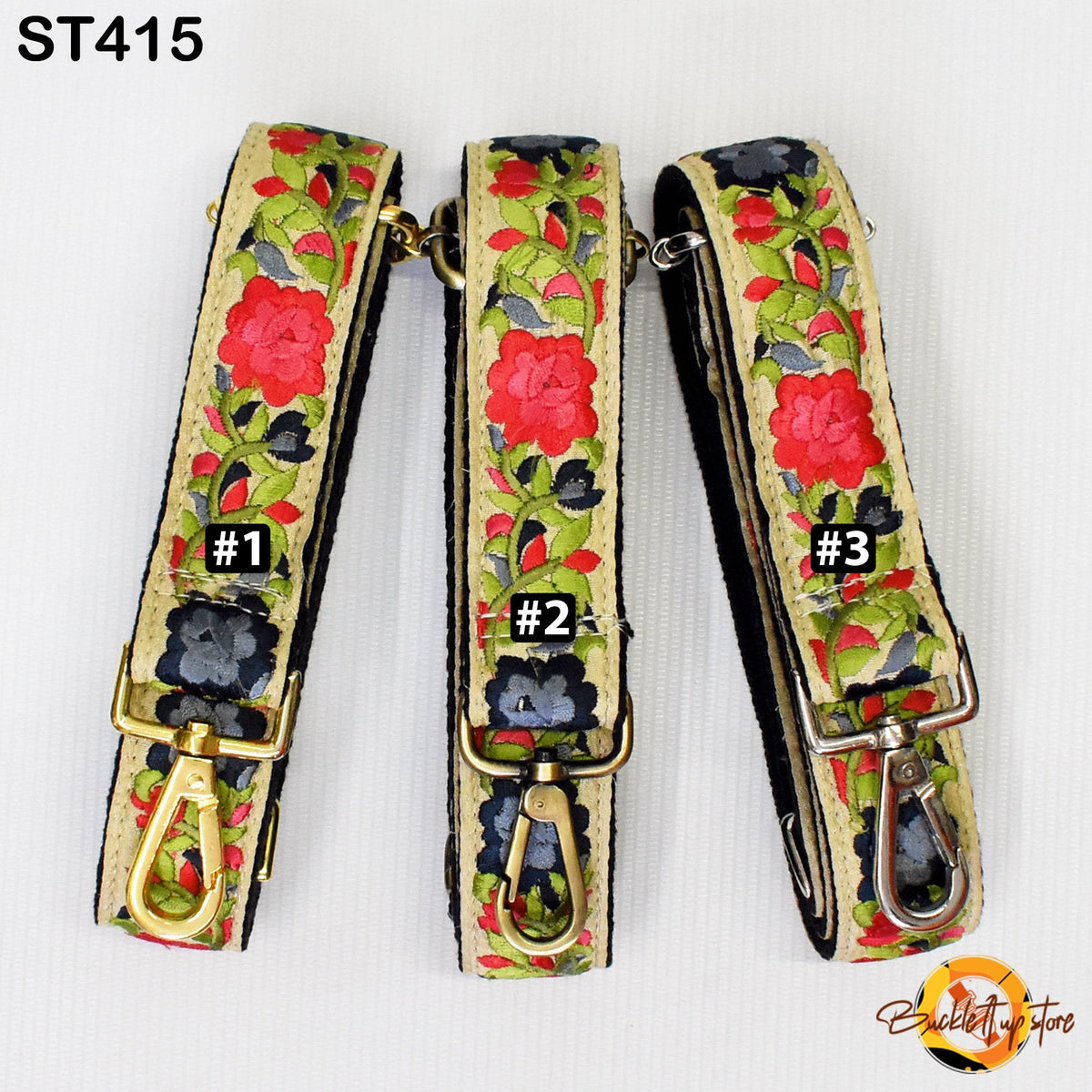 Three floral-patterned straps with numbers 1, 2, and 3 printed on them, each with a gold-colored metal clasp.