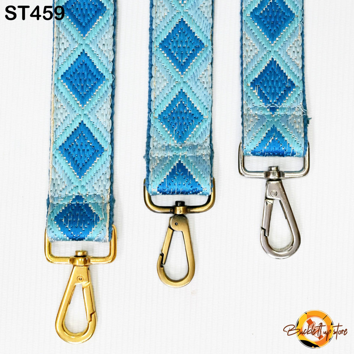Three colorful straps with metal clasps and hooks, arranged in a row against a white background.