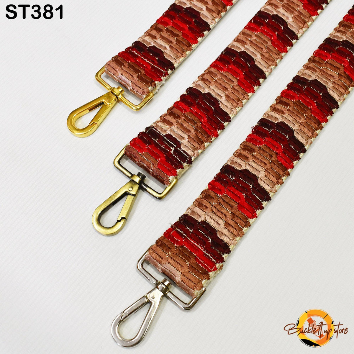 three colorful straps with metal hooks, arranged in a row.
