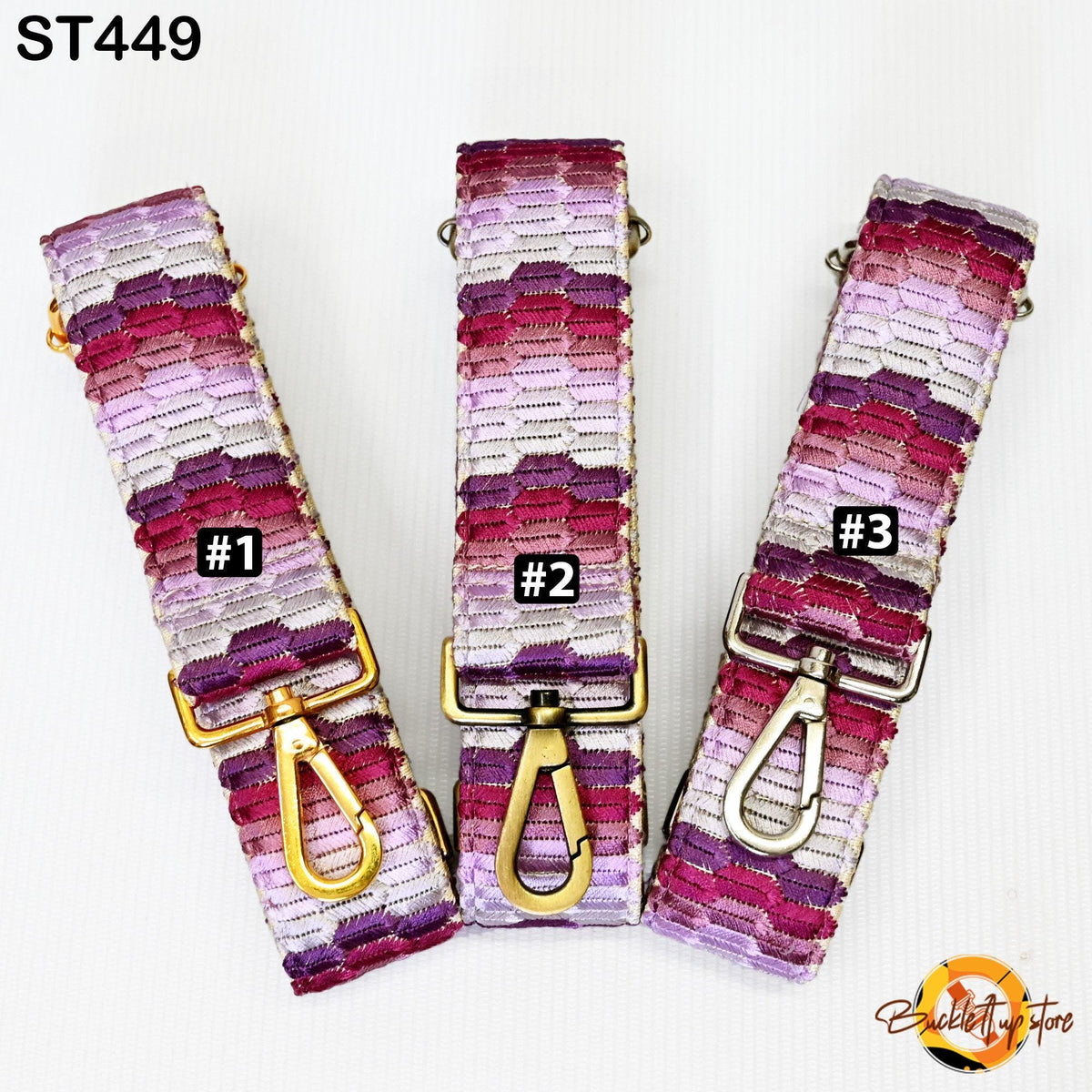 Three colorful straps with gold buckles, each with a unique number printed on it.