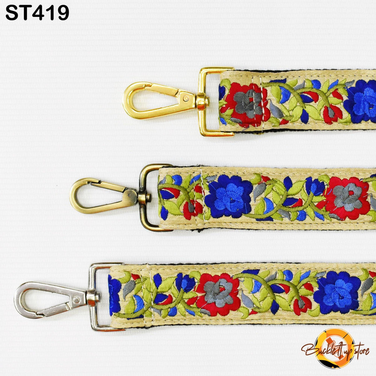 three colorful straps with floral patterns, each featuring a gold metal clasp and a silver metal attachment.