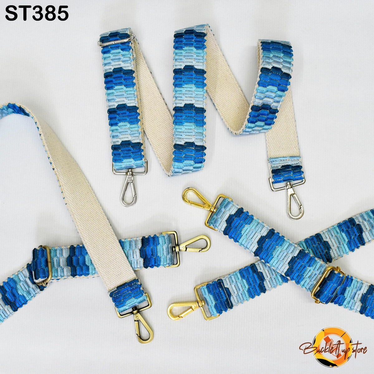 a collection of blue and white striped straps, including a large strap with a gold clasp and several smaller straps with gold clasps.