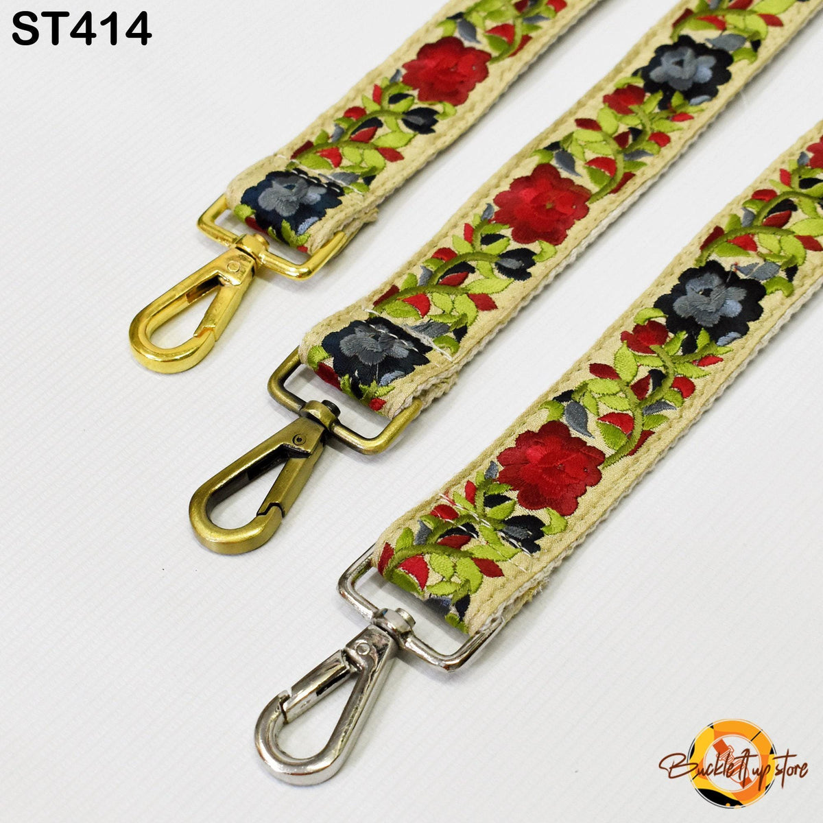 three colorful straps with floral patterns, each featuring a metal clasp and a gold-colored metal loop.