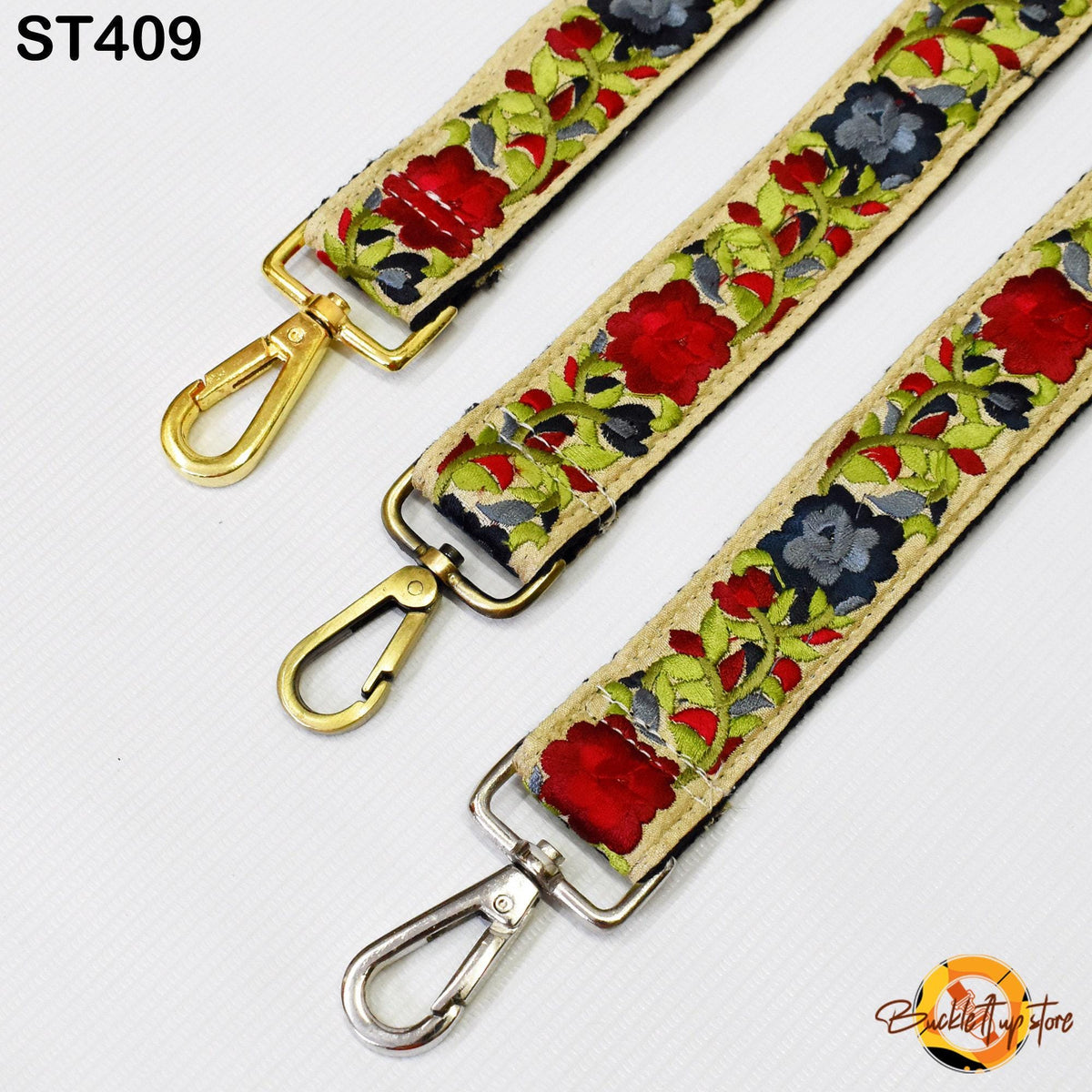 three colorful straps with floral patterns, each featuring a metal clasp and hook.