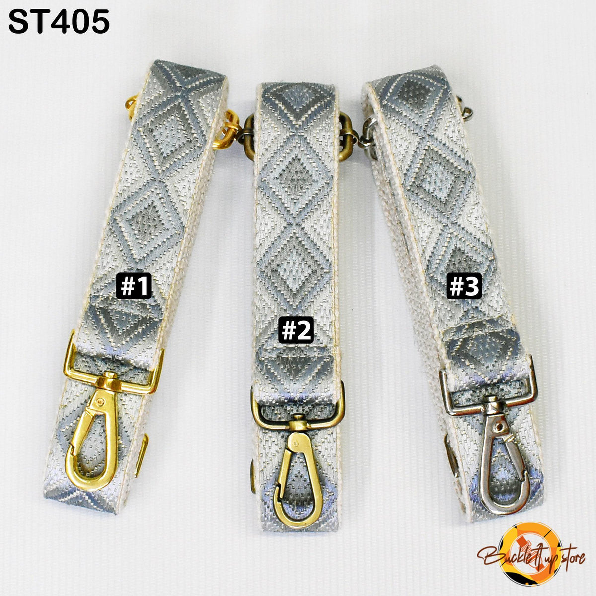 Three silver and gold patterned straps with metal hooks, each labeled with a number.