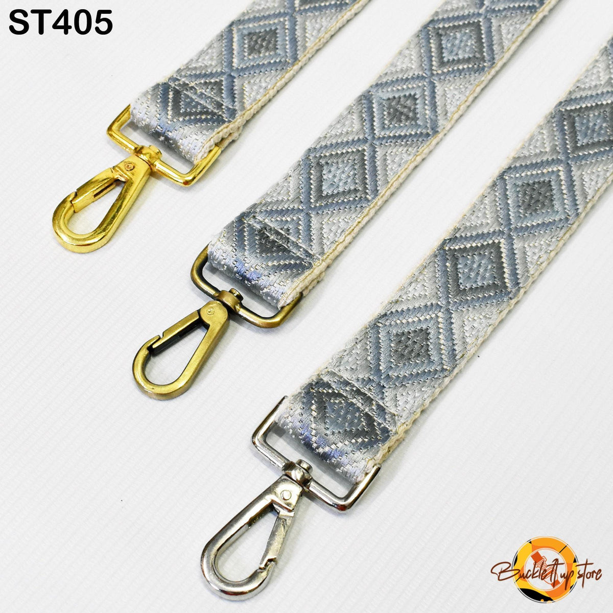 three different straps with metal hooks and buckles, arranged side by side.