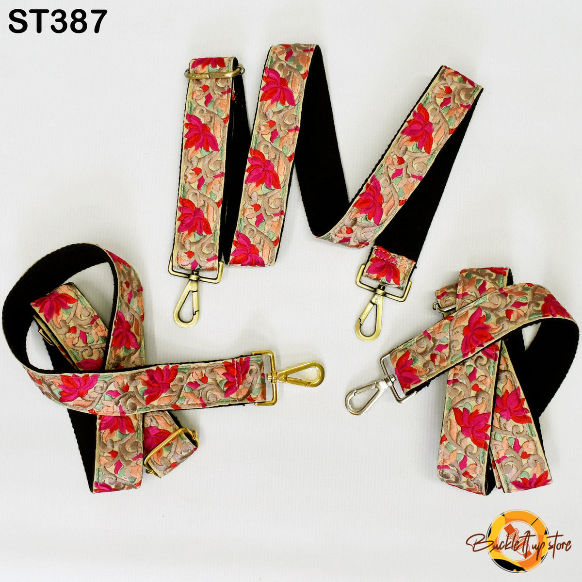a collection of colorful floral-patterned straps, including straps with gold buckles and buckles with gold chains.