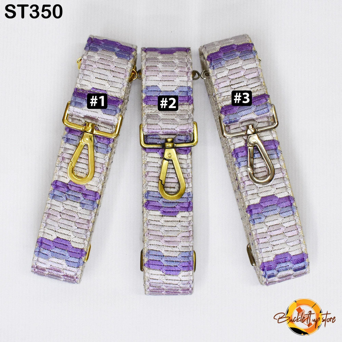 Three colorful straps with gold buckles, each with a different number printed on it.