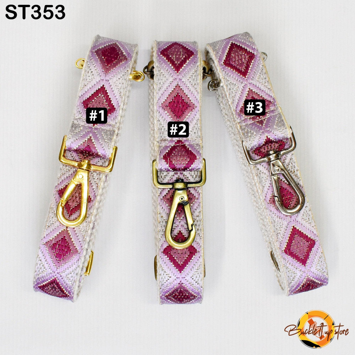 Three colorful straps with geometric patterns in shades of pink and white, each with a gold-colored metal clasp.