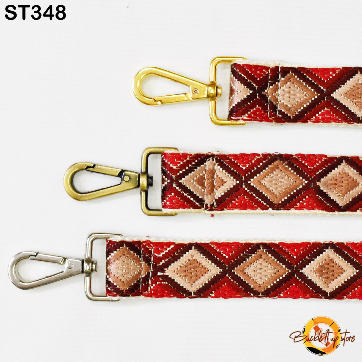 three different straps with metal hooks and decorative patterns in red, brown, and beige colors.
