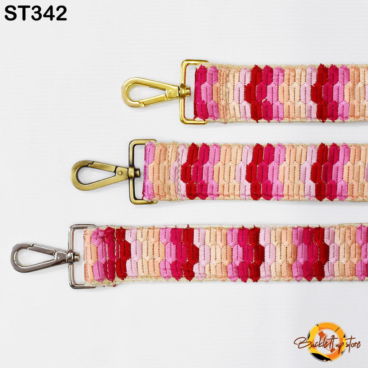 three colorful straps with gold buckles, arranged in a row against a white background.