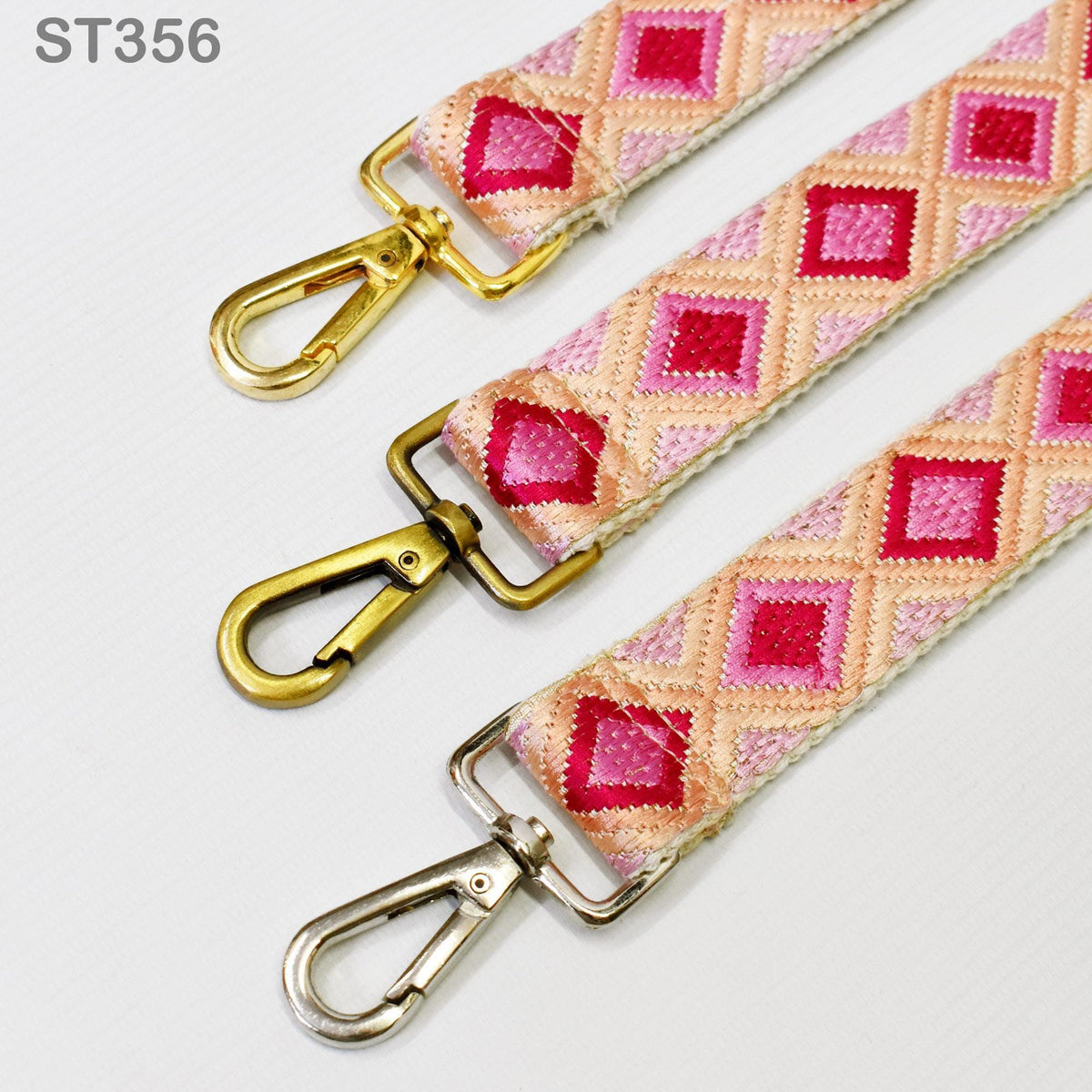 three colorful straps with gold and silver metal hooks, arranged side by side on a white background.